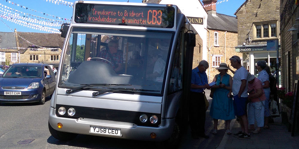 The community bus for Beaminster. Picking up passengers from the town.