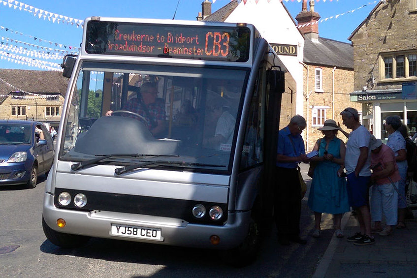 The community bus for Beaminster. Picking up passengers from the town.